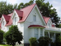 a white house with a red roof