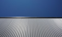 a corrugated metal roof against a blue sky