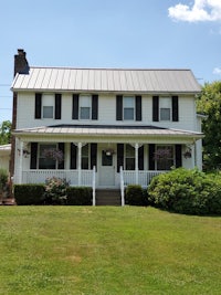 a white house with a metal roof